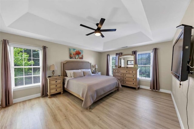 829 Verdun Way, Marietta, GA 30064 - bedroom featuring a tray ceiling, light wood finished floors, baseboards, and a ceiling fan