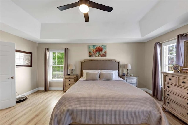 829 Verdun Way, Marietta, GA 30064 - bedroom with ceiling fan, baseboards, light wood-style floors, and a raised ceiling