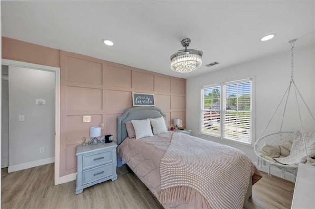 829 Verdun Way, Marietta, GA 30064 - bedroom featuring a decorative wall, light wood finished floors, baseboards, visible vents, and recessed lighting