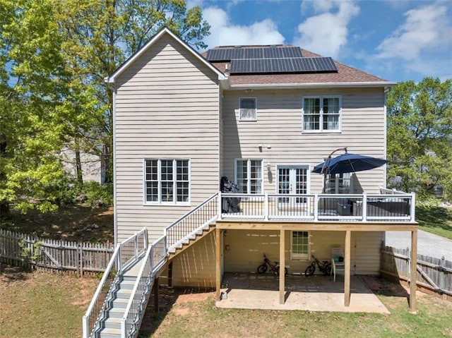 829 Verdun Way, Marietta, GA 30064 - rear view of property featuring stairway, a fenced backyard, a patio, solar panels, and a wooden deck