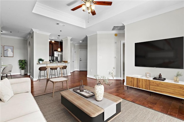 325 E Paces Ferry Rd NE Unit 703, Atlanta, GA 30305 - living area featuring ceiling fan, ornamental molding, dark wood-type flooring, baseboards, and a raised ceiling