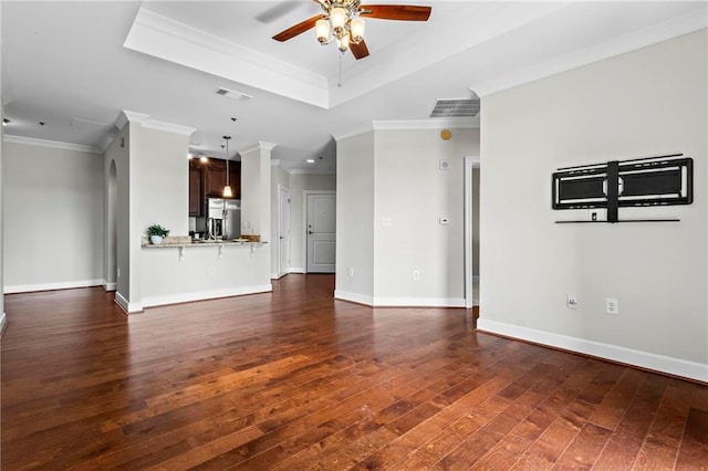 325 E Paces Ferry Rd NE Unit 703, Atlanta, GA 30305 - unfurnished living room featuring ceiling fan, dark wood-type flooring, ornamental molding, a raised ceiling, and baseboards