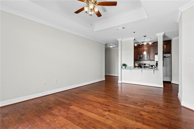 325 E Paces Ferry Rd NE Unit 703, Atlanta, GA 30305 - unfurnished living room featuring ornamental molding, a ceiling fan, dark wood finished floors, a tray ceiling, and baseboards