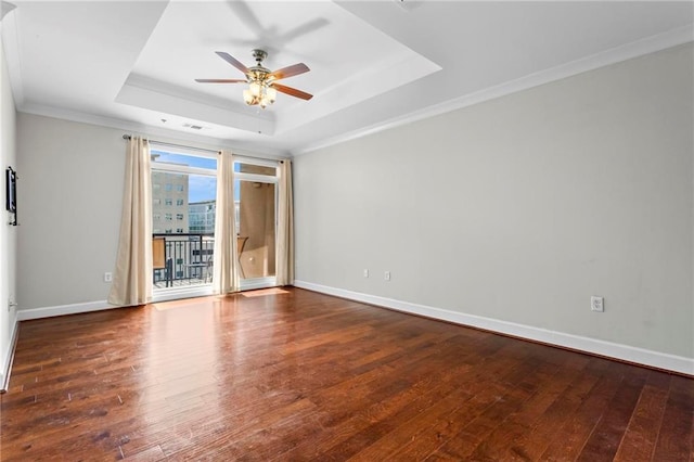 325 E Paces Ferry Rd NE Unit 703, Atlanta, GA 30305 - empty room with a tray ceiling, ceiling fan, hardwood / wood-style floors, baseboards, and crown molding