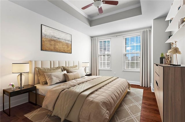 325 E Paces Ferry Rd NE Unit 703, Atlanta, GA 30305 - bedroom featuring a raised ceiling, crown molding, dark wood-type flooring, baseboards, and a ceiling fan