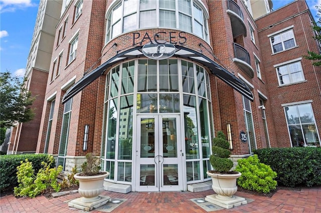 325 E Paces Ferry Rd NE Unit 703, Atlanta, GA 30305 - view of exterior entry featuring french doors and brick siding