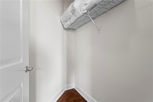 325 E Paces Ferry Rd NE Unit 703, Atlanta, GA 30305 - walk in closet featuring dark wood-type flooring