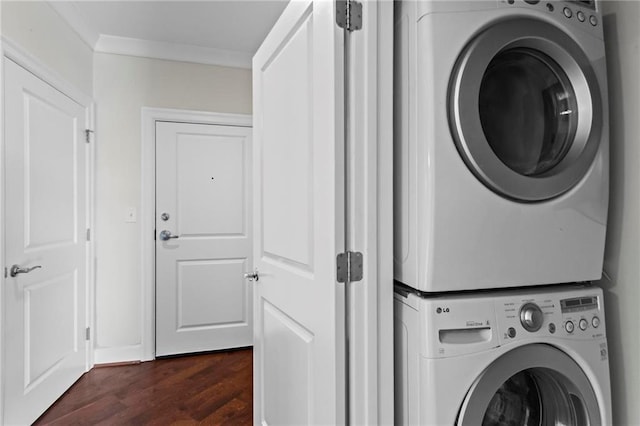 325 E Paces Ferry Rd NE Unit 703, Atlanta, GA 30305 - laundry room with estacked washer and dryer, ornamental molding, and dark wood-style flooring