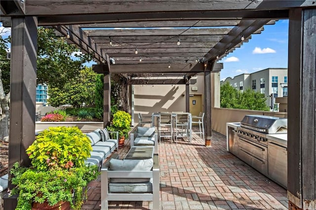 325 E Paces Ferry Rd NE Unit 703, Atlanta, GA 30305 - view of patio with a pergola, outdoor dining space, an outdoor hangout area, and exterior kitchen