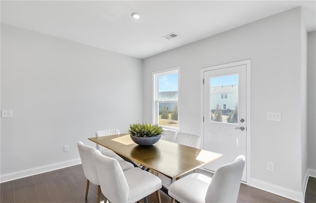 dining room with dark hardwood / wood-style floors