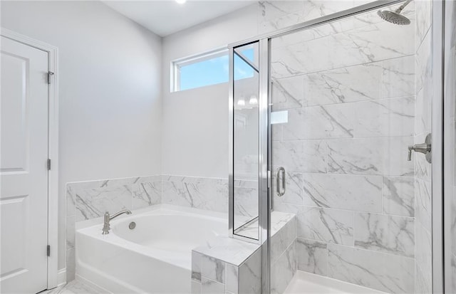 bathroom with separate shower and tub