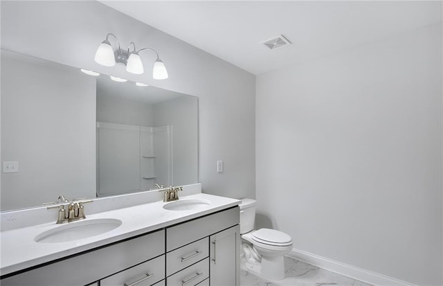 bathroom with toilet, vanity, and a shower