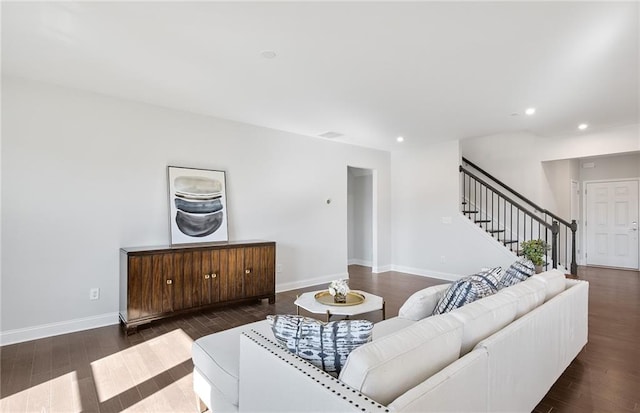 living room featuring dark wood-type flooring