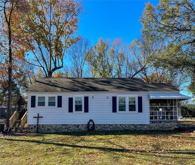 view of property exterior featuring a lawn