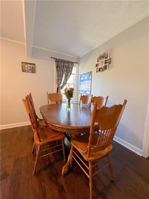 dining area with dark hardwood / wood-style floors and a textured ceiling