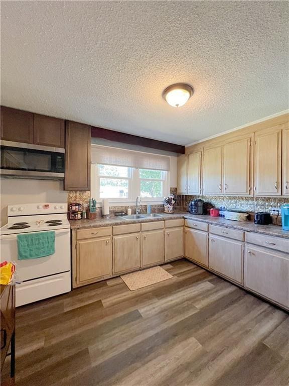 kitchen featuring dark wood-type flooring, backsplash, sink, and electric range