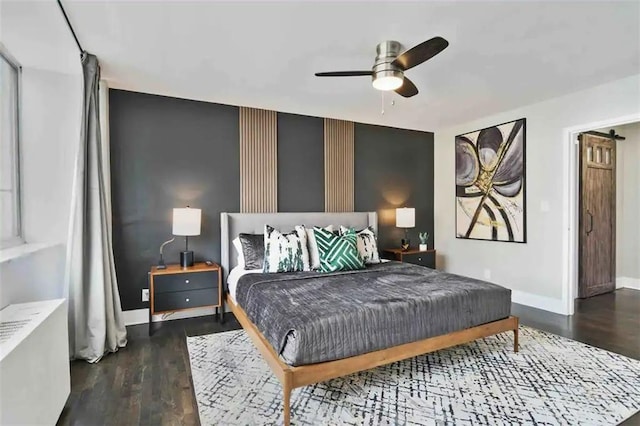 bedroom featuring ceiling fan and dark hardwood / wood-style flooring