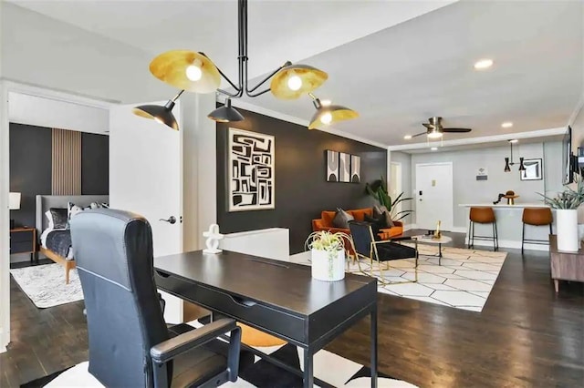 dining room featuring ornamental molding, dark hardwood / wood-style floors, and ceiling fan