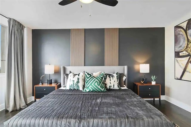 bedroom with ceiling fan and dark hardwood / wood-style floors