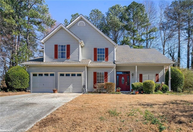 traditional-style home featuring driveway, covered porch, a shingled roof, and a garage