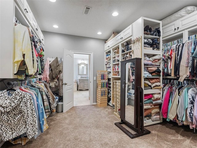 spacious closet featuring carpet floors