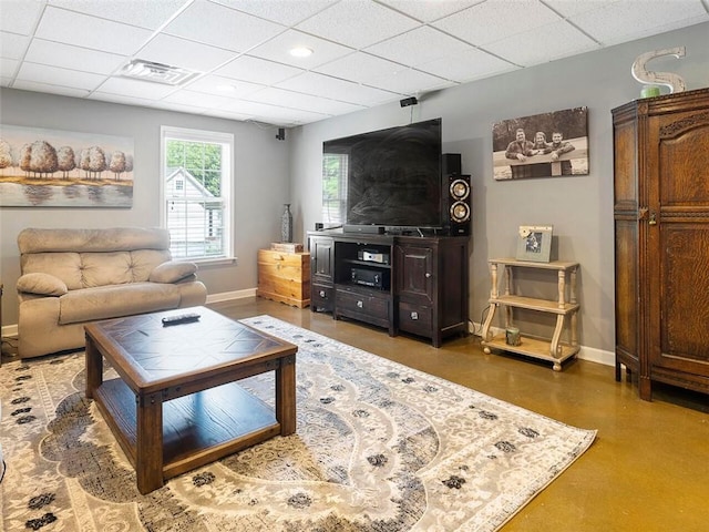 living room with a paneled ceiling