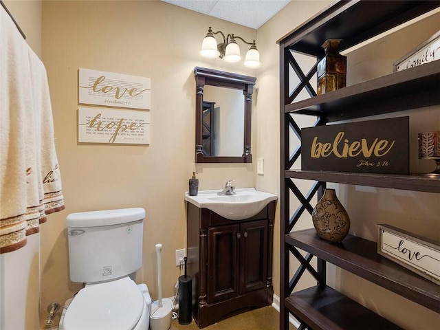 bathroom with oversized vanity and toilet