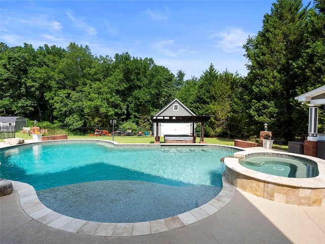 view of pool with a gazebo and an in ground hot tub