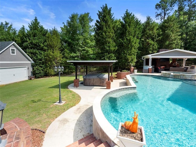 view of pool featuring a patio area, an outdoor hot tub, a yard, and a garage