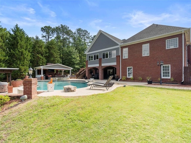 view of pool featuring a patio and a yard