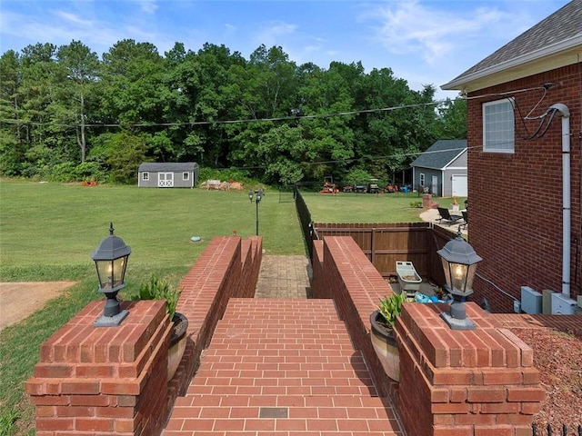 view of patio featuring a storage unit