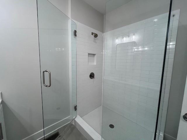 bathroom featuring an enclosed shower