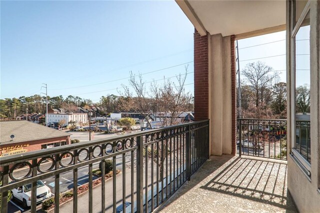 3820 Roswell Rd NE Unit 317, Atlanta, GA 30342 - living room featuring light tile patterned floors, a tray ceiling, and a high ceiling