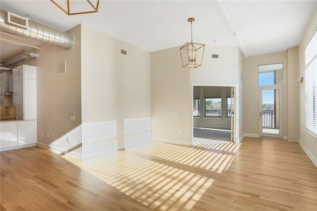 3820 Roswell Rd NE Unit 317, Atlanta, GA 30342 - spare room with a notable chandelier, baseboards, and carpet floors