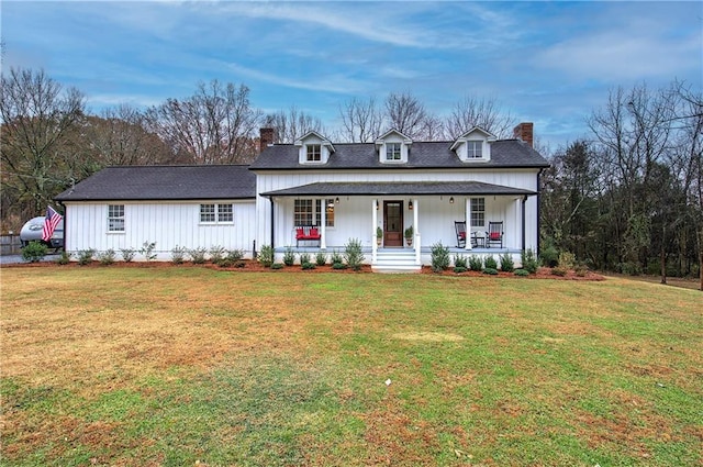 view of front of property with a front yard and a porch