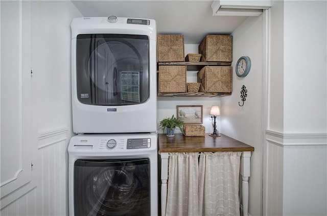 laundry area featuring stacked washer and dryer