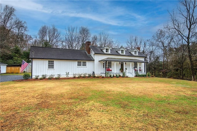 view of front of home with a front lawn and covered porch