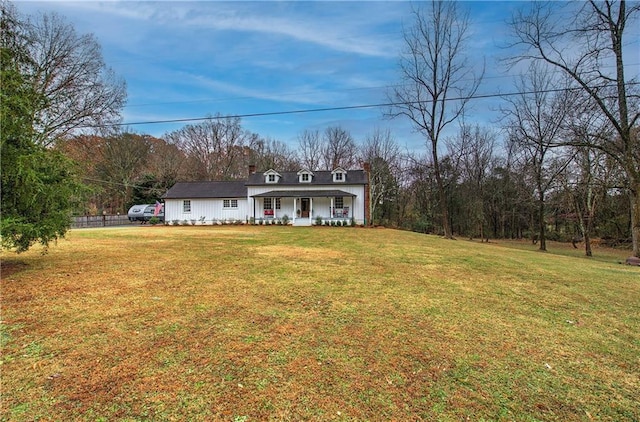 view of front facade with covered porch and a front lawn