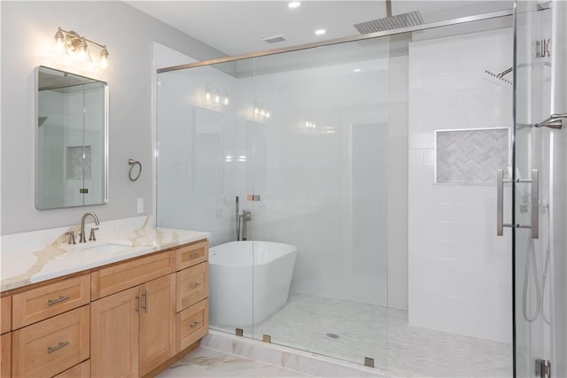 3286 Bachelor St, East Point, GA 30344 - full bathroom featuring a stall shower, vanity, a freestanding bath, marble finish floors, and recessed lighting