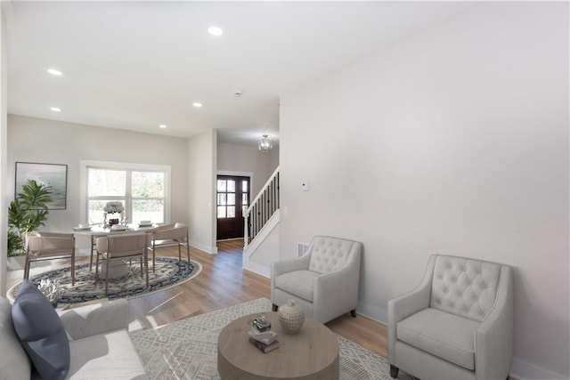 3286 Bachelor St, East Point, GA 30344 - living room with stairway, light wood-style floors, recessed lighting, and an office area