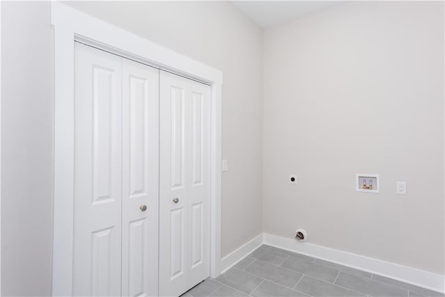 3286 Bachelor St, East Point, GA 30344 - laundry area featuring electric dryer hookup, washer hookup, and light tile patterned floors
