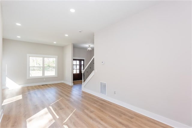 3286 Bachelor St, East Point, GA 30344 - unfurnished living room with stairs, recessed lighting, and light wood finished floors