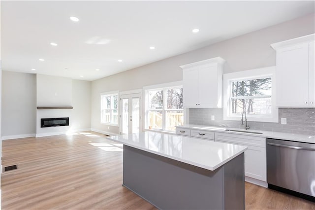 3286 Bachelor St, East Point, GA 30344 - kitchen featuring dishwasher, plenty of natural light, a kitchen island, light countertops, and recessed lighting