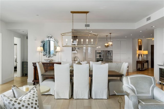 3107 Peachtree Rd NE Unit 1403, Atlanta, GA 30305 - dining room featuring visible vents, light wood-type flooring, a chandelier, and recessed lighting