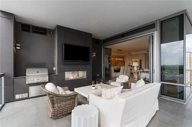 3107 Peachtree Rd NE Unit 1403, Atlanta, GA 30305 - living room with a large fireplace and light tile patterned flooring