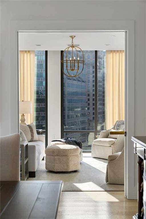 3107 Peachtree Rd NE Unit 1403, Atlanta, GA 30305 - living area with wood finished floors and an inviting chandelier