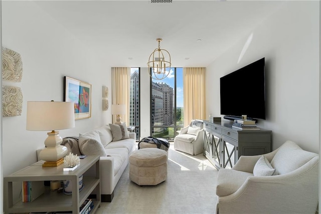 3107 Peachtree Rd NE Unit 1403, Atlanta, GA 30305 - living area with a chandelier and a wall of windows