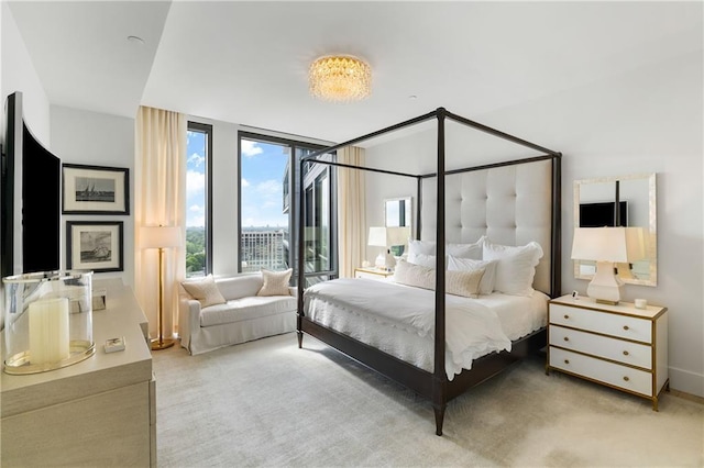 3107 Peachtree Rd NE Unit 1403, Atlanta, GA 30305 - bedroom featuring light colored carpet and a wall of windows