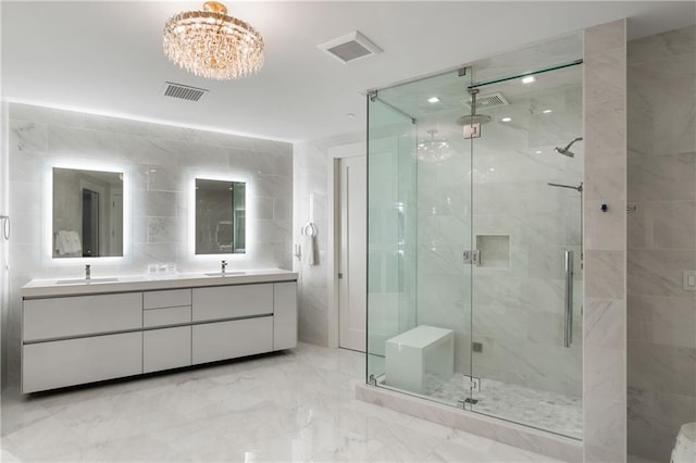 3107 Peachtree Rd NE Unit 1403, Atlanta, GA 30305 - full bathroom featuring visible vents, marble finish floor, a sink, and a stall shower
