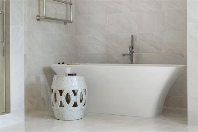 3107 Peachtree Rd NE Unit 1403, Atlanta, GA 30305 - full bath featuring a freestanding bath, tile patterned flooring, and tile walls